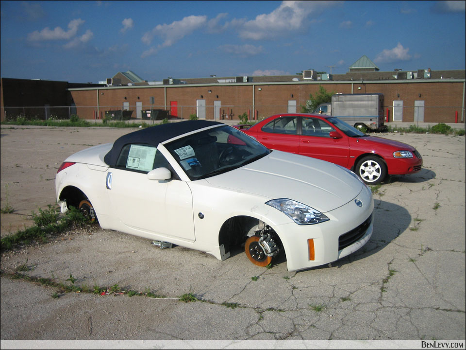 I saw a White Nissan 350Z that had an awkward lean when passing the parking