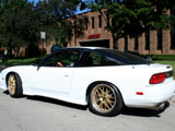 White 240SX with gold wheels