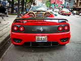 Rear of Red Ferrari 360 parked on Rush Street